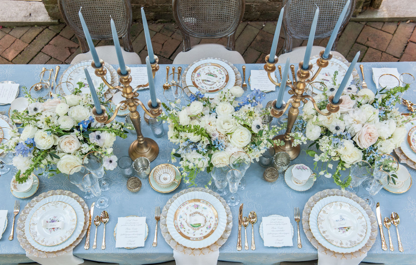 Blue wedding details tablescape in the Barnsley Garden Resort Ruins photographed by Julie Anne Wedding Photography, luxury fine art photographer for intimate and joyful moments located in Atlanta, Tampa, Orlando,